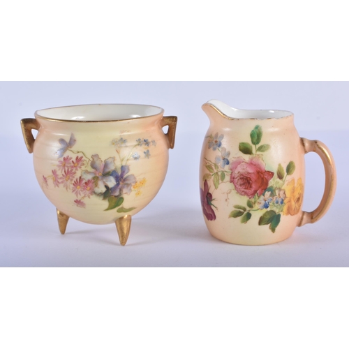 194 - Royal Worcester miniature coffee cup and saucer painted with flowers on a blush ivory ground, date 1... 