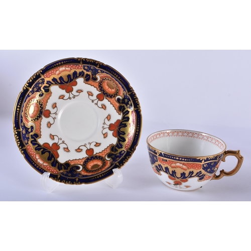 196 - Royal Crown Derby pair of teacups, saucers and side plates painted with an imari pattern. Cup 10cm h... 