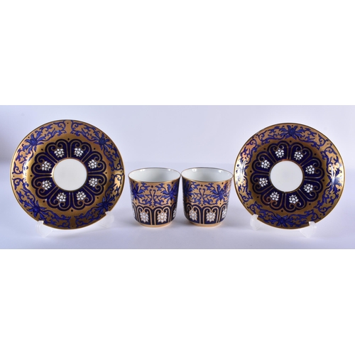 197 - Late 19th century Coalport pair coffee cups, saucers and side plates decorated with elaborate gildin... 