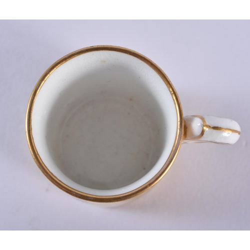 198 - Late 19th century Coalport miniature coffee can and saucer with solid gold ground, the can with a si... 