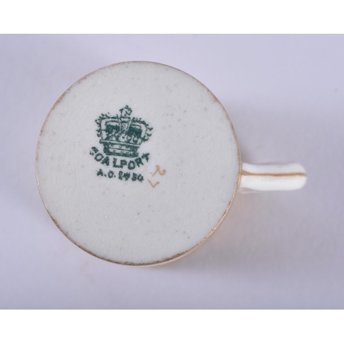 198 - Late 19th century Coalport miniature coffee can and saucer with solid gold ground, the can with a si... 