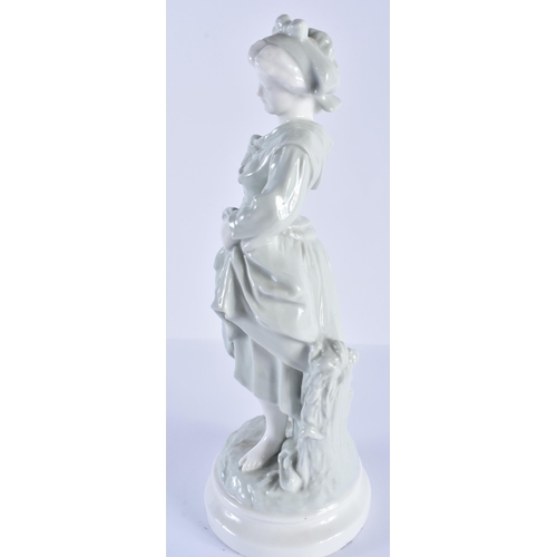 203 - French porcelain celadon figure of a country girl. Figure 32cm high