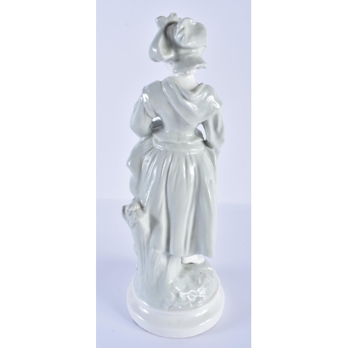 203 - French porcelain celadon figure of a country girl. Figure 32cm high