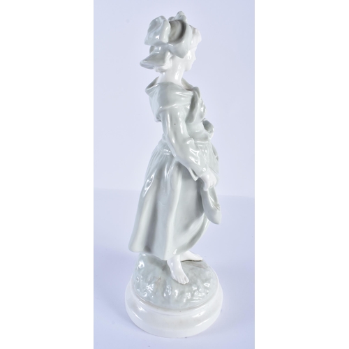 203 - French porcelain celadon figure of a country girl. Figure 32cm high