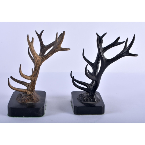 211 - A MATCHED PAIR OF ANTIQUE COLD PAINTED BRONZE STAG ANTLER PEN RESTS. 18 cm x 12 cm.