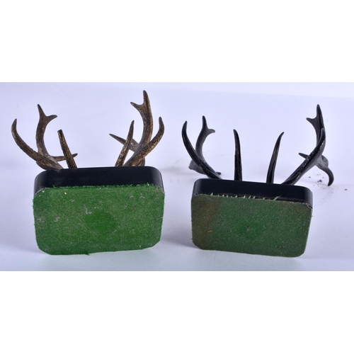 211 - A MATCHED PAIR OF ANTIQUE COLD PAINTED BRONZE STAG ANTLER PEN RESTS. 18 cm x 12 cm.