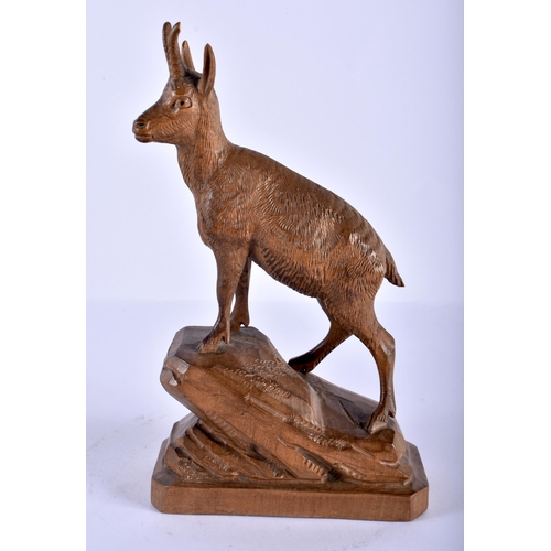 212 - A BLACK FOREST BAVARIAN CARVED WOOD IBEX together with a bronze nymph, 21 cm high. (2)