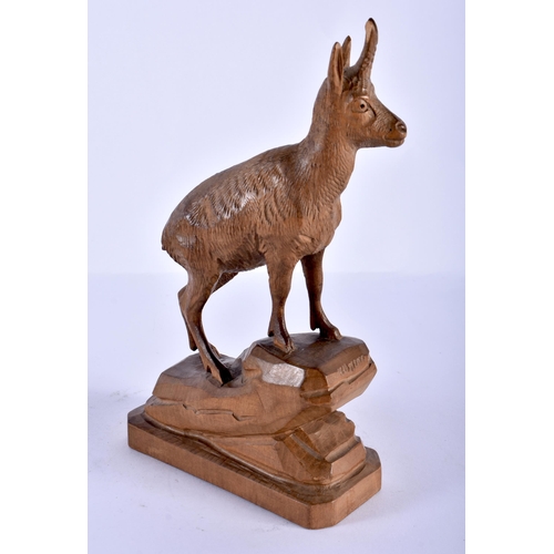 212 - A BLACK FOREST BAVARIAN CARVED WOOD IBEX together with a bronze nymph, 21 cm high. (2)