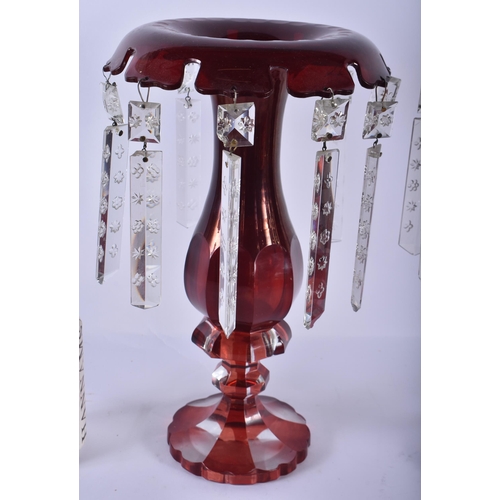 216 - A PAIR OF ANTIQUE CRANBERRY GLASS LUSTRES. 30 cm high.