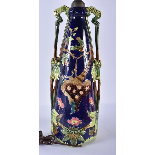 217 - A LARGE ART NOUVEAU MAJOLICA LAMP decorated with dead game. 62 cm high.