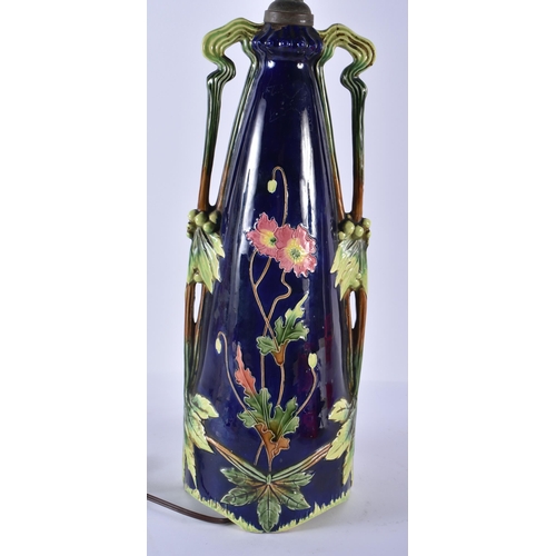 217 - A LARGE ART NOUVEAU MAJOLICA LAMP decorated with dead game. 62 cm high.