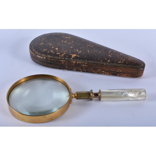 219 - A LARGE ANTIQUE LEATHER CASED MOTHER OF PEARL HANDLED MAGNIFYING GLASS. 24 cm long.