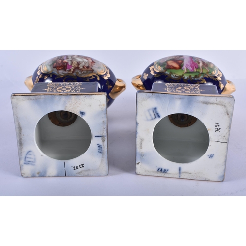 228 - A PAIR OF TWIN HANDLED VIENNA STYLE VASES. 18 cm x 14 cm.