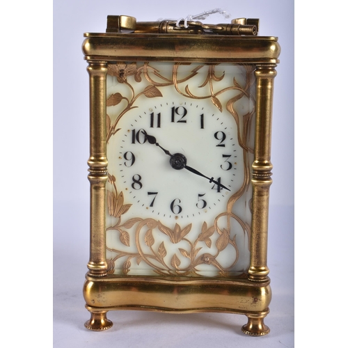 239 - AN ANTIQUE FRENCH CARRIAGE CLOCK with art nouveau overlaid decoration. 16cm high inc handle.