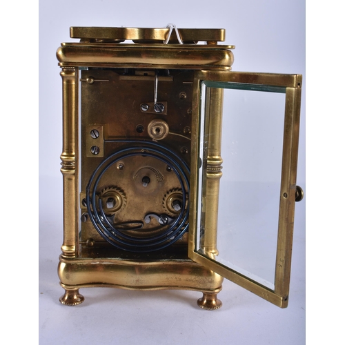 239 - AN ANTIQUE FRENCH CARRIAGE CLOCK with art nouveau overlaid decoration. 16cm high inc handle.