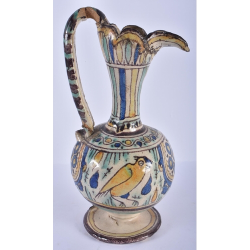 240 - AN ANTIQUE MAJOLICA POTTERY JUG painted with birds and motifs. 25cm high.