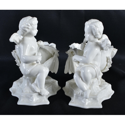 276 - A PAIR OF 19TH CENTURY CONTINENTAL WHITE GLAZED FIGURAL DISHES. 15 cm x 15 cm.