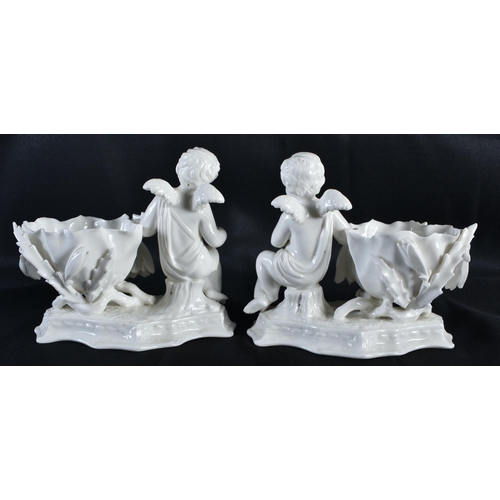 276 - A PAIR OF 19TH CENTURY CONTINENTAL WHITE GLAZED FIGURAL DISHES. 15 cm x 15 cm.