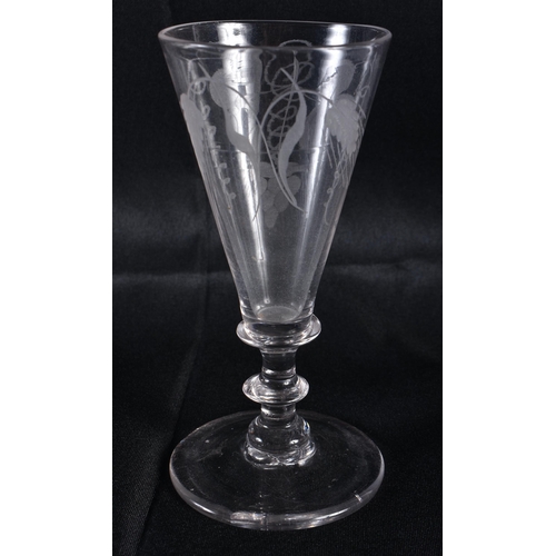 280 - A SMALL ANTIQUE ENGRAVED WINE GLASS. 13.5 cm high.