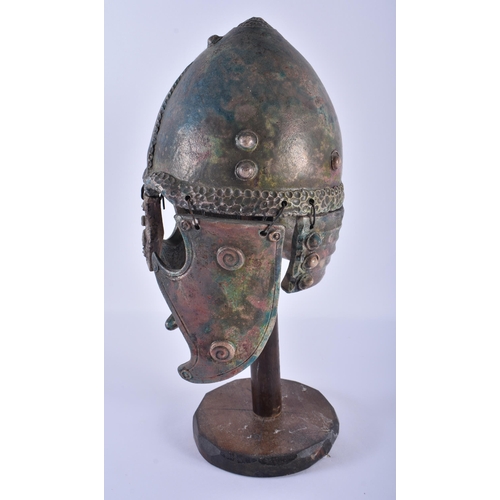 287 - A BRONZED POTTERY CLASSICAL HELMET. 38 cm high.