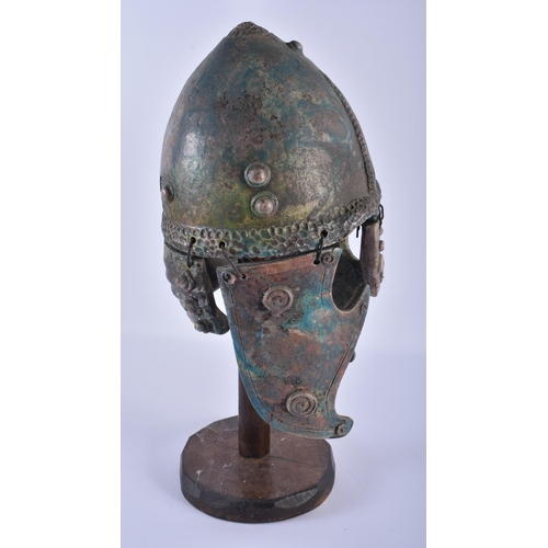 287 - A BRONZED POTTERY CLASSICAL HELMET. 38 cm high.