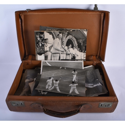 295 - CRICKET INTEREST a suitcase containing mainly 1950s press photographs of Surrey CC etc. (qty)