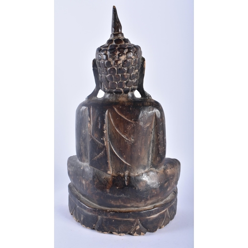 349 - A LARGE 19TH CENTURY SOUTHEAST ASIAN LACQUERED WOOD BUDDHA modelled upon a lotus base. 34 cm x 18cm.