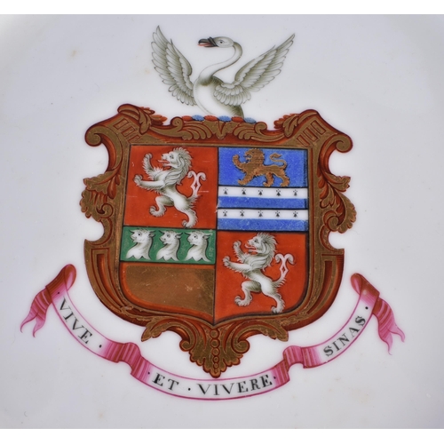 35 - AN EARLY 19TH CENTURY CHAMBERLAINS WORCESTER ARMORIAL PLATE painted with flowers on an apple ground.... 