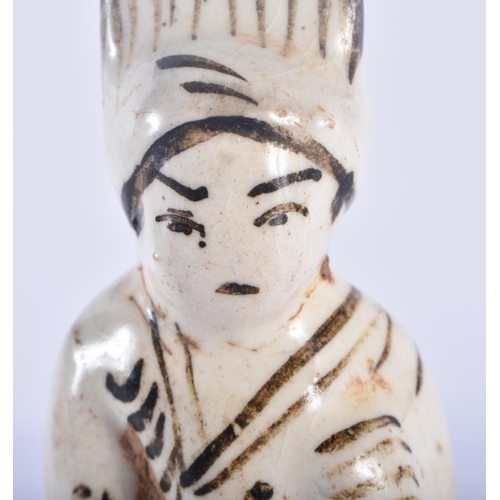 359 - A RARE 17TH CENTURY CHINESE CHIZOU POTTERY FIGURE OF A MALE painted with motifs. 12.5 cm high.