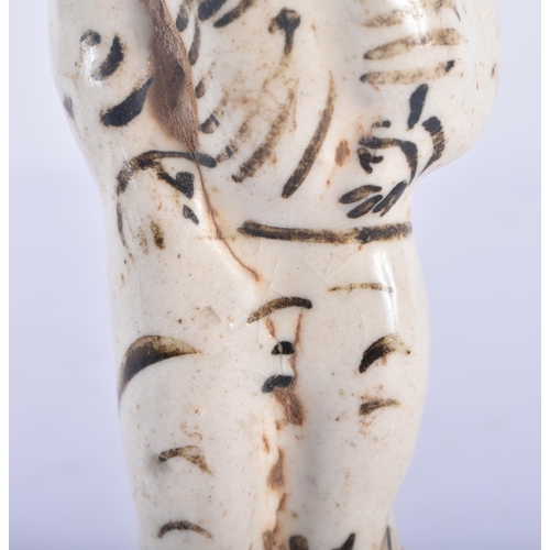 359 - A RARE 17TH CENTURY CHINESE CHIZOU POTTERY FIGURE OF A MALE painted with motifs. 12.5 cm high.