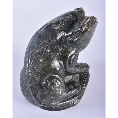 361 - A 19TH CENTURY CHINESE CARVED GREEN STONE FIGURE OF A RECUMBENT BEAST Qing. 12 cm x 7.5 cm.