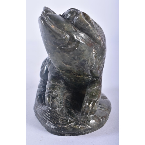 361 - A 19TH CENTURY CHINESE CARVED GREEN STONE FIGURE OF A RECUMBENT BEAST Qing. 12 cm x 7.5 cm.