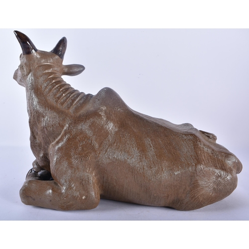 362 - AN UNUSUAL LATE 19TH CENTURY CHINESE CARVED POTTERY FIGURE OF A RECUMBENT BULL Late Qing. 32 cm x 24... 