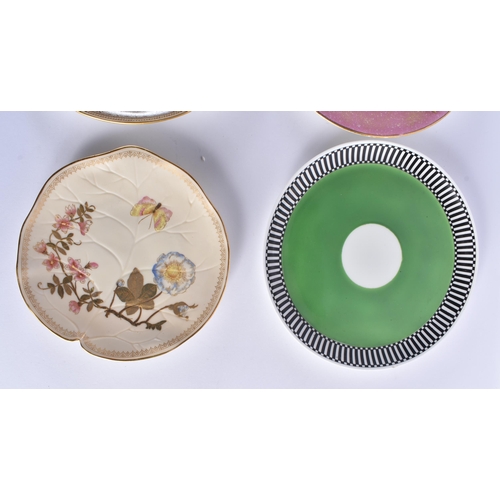 37 - SIX ROYAL WORCESTER AESTHETIC MOVEMENT PORCELAIN PLATES in various forms and designs. 23cm wide. (6)