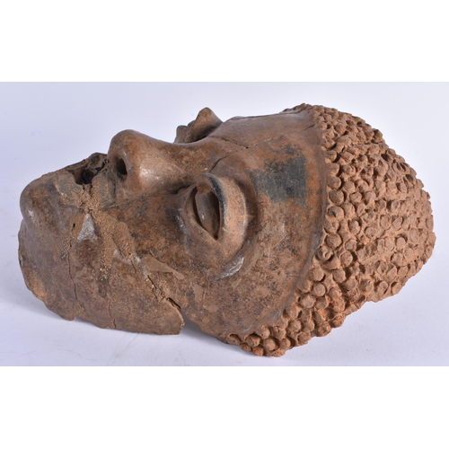 379 - AN EARLY AFRICAN CLAY POTTERY MASK OF AN TRIBAL ETHNIC MALE. 24 cm x 16cm.