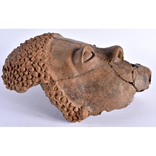 379 - AN EARLY AFRICAN CLAY POTTERY MASK OF AN TRIBAL ETHNIC MALE. 24 cm x 16cm.