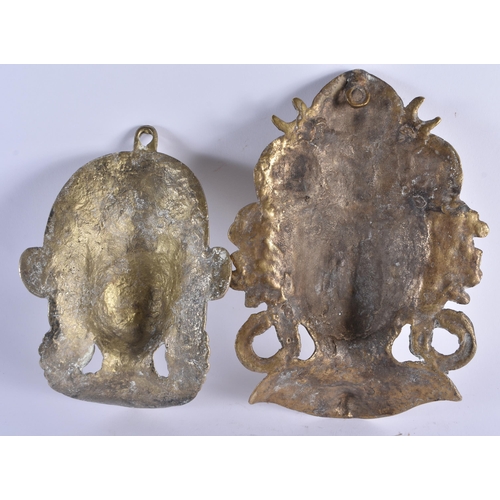 384 - TWO LATE 19TH CENTURY INDIAN BRONZE WALL HANGING DEITY MASKS. Largest 22cm x 15 cm. (2)