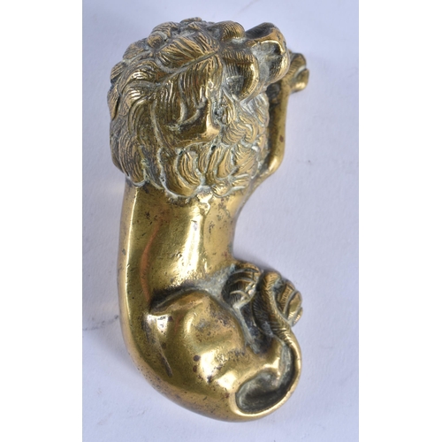 385 - AN EARLY 19TH CENTURY ENGLISH REGENCY BRONZE FIGURE OF A LION modelled recumbent. 12 cm x 6 cm.