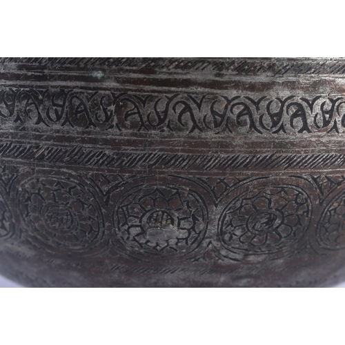 393 - A 16TH/17TH CENTURY PERSIAN STEEL AND COPPER ALLOY BOWL decorated all over with motifs and foliage. ... 