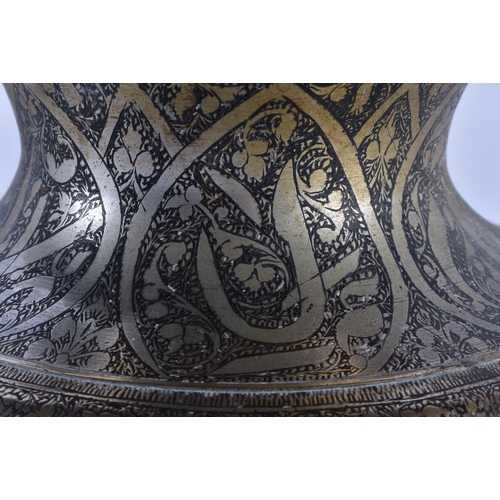 396 - AN 18TH/19TH CENTURY INDO PERSIAN BRONZE AND SILVER INLAID HOOKAH PIPE BASE decorated with scripture... 