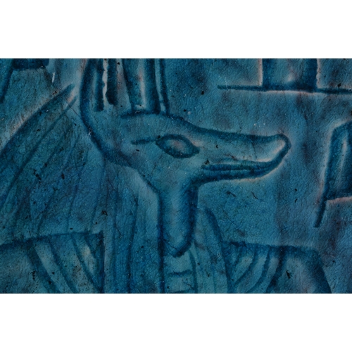 405 - AN EGYPTIAN TURQUOISE GLAZED ANUBIS FAIENCE TILE possibly Antiquity. 9.5 cm x 9.5 cm.