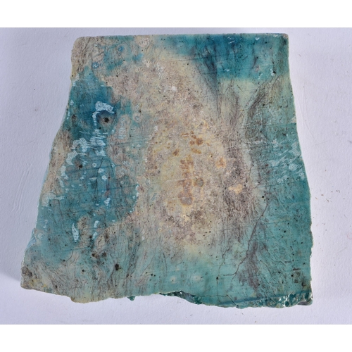 405 - AN EGYPTIAN TURQUOISE GLAZED ANUBIS FAIENCE TILE possibly Antiquity. 9.5 cm x 9.5 cm.