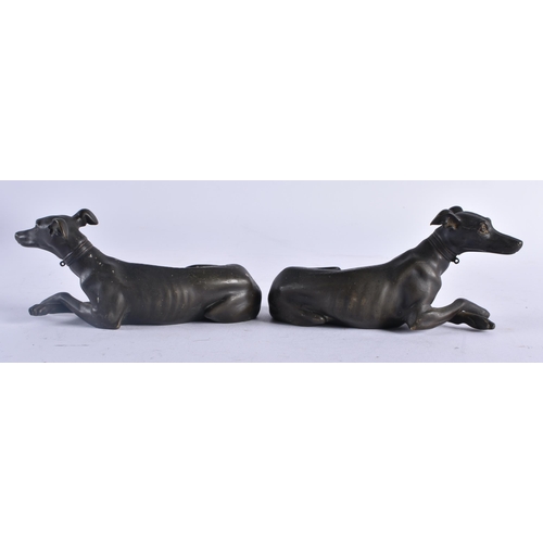 435 - A LOVELY PAIR OF REGENCY COUNTRY HOUSE BRONZE FIGURES OF GREYHOUNDS modelled recumbent. 15 cm x 7 cm... 