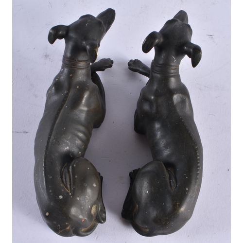 435 - A LOVELY PAIR OF REGENCY COUNTRY HOUSE BRONZE FIGURES OF GREYHOUNDS modelled recumbent. 15 cm x 7 cm... 