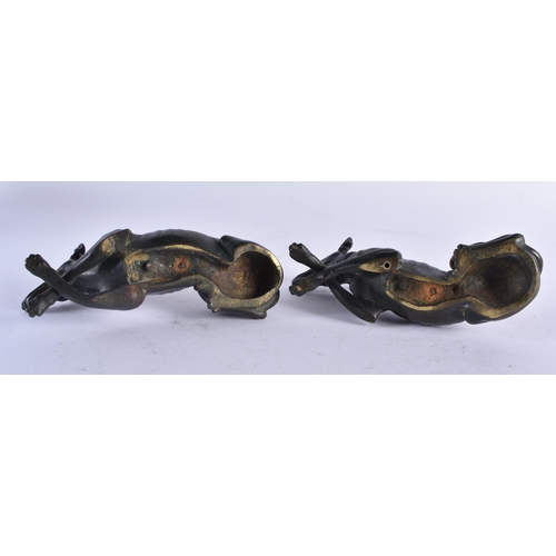 435 - A LOVELY PAIR OF REGENCY COUNTRY HOUSE BRONZE FIGURES OF GREYHOUNDS modelled recumbent. 15 cm x 7 cm... 