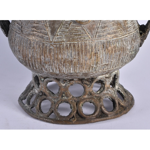 442 - AN AFRICAN TRIBAL BRONZE VESSEL AND COVER formed with figures upon an open work base. 24 cm x 13 cm.