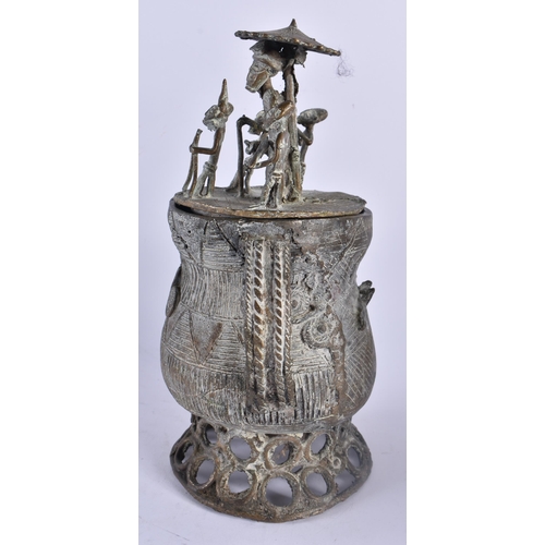 442 - AN AFRICAN TRIBAL BRONZE VESSEL AND COVER formed with figures upon an open work base. 24 cm x 13 cm.