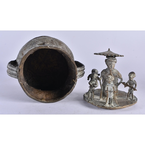 442 - AN AFRICAN TRIBAL BRONZE VESSEL AND COVER formed with figures upon an open work base. 24 cm x 13 cm.