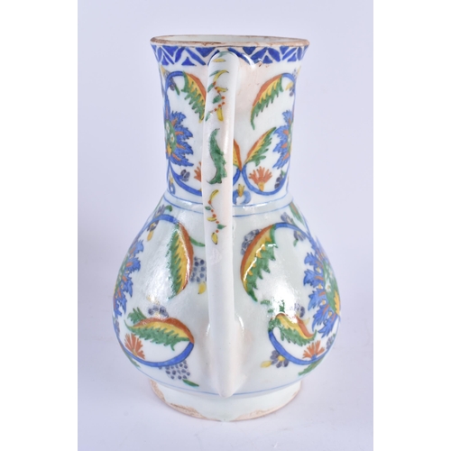 447 - A LARGE TURKISH KUTAHYA IZNIK STYLE POTTERY JUG. 23.5 cm high.