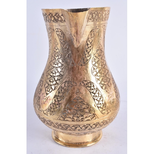 448 - A LARGE TURKISH TOMBAK OTTOMAN STYLE GILDED COPPER ENGRAVED JUG. 25cm high.